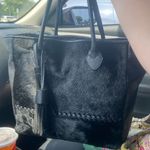 Real Italian Leather and cow hide tote. Black with tassel accents. 18 x 13" Photo 1