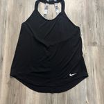  black and white  tank top. Features white Nike logo and straps. Photo 6