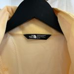 The North Face  - Buttery Yellow Hooded Rain Jacket Photo 1