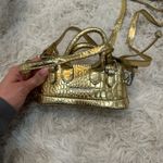 Amazon Mini gold purse Photo 1