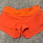 Lululemon  Athletica Bright Orange Athletic Shorts Photo 0