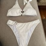 Zaful Chic cream bikini with heart accents. Halter top and matching bottoms. Perfect for beach days. Photo 2
