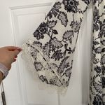 ASTR NWOT The Label mini dress with v-neck and statement sleeves. Photo 1