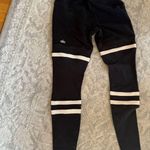 Alo Yoga  black and tan leggings  Photo 1