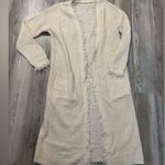 Boho Style Cream knit duster with fringe detailing, long sleeve, and open fron Size undefined Photo 0