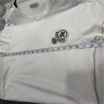  Tee Only worn once, looks and feels brand new. All tags still attached. Elevate your casual wardrobe with this Moncler white t-shirt. Photo 13