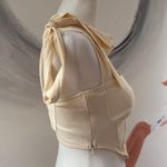 Cider  bandeau.  Size Small. Zip closure on side. Straps tie into bows. Photo 3
