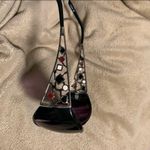 Black sunglasses with red, white, and black design Photo 3