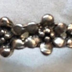 An antiqued collection of silver studs delicately coalesce into a dainty band of Size 6 Photo 0