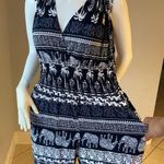 New Women’s dark Navy Blue jumpsuit size L/XL for size 14 New with tags Straps are adjustable Stretchy with front pockets Photo 9