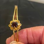 Gold Floral Bracelet with Red Gemstone Photo 2