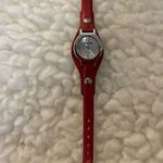 Mudd  Analog Wristwatch Metallic Red Buckle Band Round Silver Tone Face. Photo 0