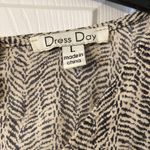 Dress Day Romper size L long 27” bust 36” excellent condition tan & black color Size L Photo 1