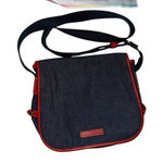 Dooney & Bourke  denim messenger bag with red leather trim Photo 0