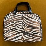 Zebra print make up bag, shades of brown bronze, and black Photo 1