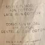 The Impeccable Pig Cream Cropped Lace Arm Accent Top Photo 3