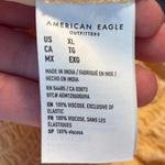 American Eagle One-Shoulder Jumpsuit in Soft Yellow Photo 3