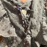 Altar'd State flowy, A-line maxi dress with a tiered skirt and a deep V-neckline or open-back design. Photo 9