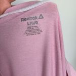 Reebok  Women's Soft Pink Tee  Chic and comfy short sleeve tee. Ideal for everyday wear.Small stains shown.  Photo 2