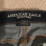 American Eagle  dark wash ripped knees super stretch skinny jeans Photo 1