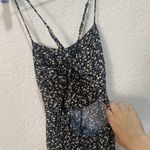 Lulu’s floral jumpsuit with slit sides size small Black Photo 3