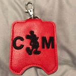 Disney ’s Cast Member Hand Sanitizer Holder with Mickey Silhouette Photo 0