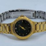 Bill Blass  23mm Quartz analog Womens gold tone black dial up to 7.5” runs Photo 0