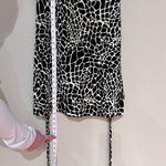 Valerie Bertinelli Black and Tan Animal Print Sleeveless Mini Dress Photo 6