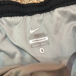 Nike Orange Tiger Print  Shorts. Gently worn. From a non a non smoking household. Photo 2