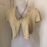 2000s Gold sparkle cropped short sleeve ruffle hem cardigan button front Photo 1