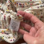 Main Strip  oversize sweater.  Off the shoulder.  Size Small. Twist back. Photo 4