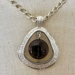 é silver tone and purple teardrop pendant necklace Silver Photo 1