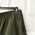 Athleta  Expedition Shorts Green Black Side Stripe Nylon Baggy Shorts 4 Photo 2