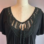 L8ter  black top crochet lace neckline fitted bust flares out at the hips Size M Photo 1
