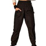 Free People Movement NWT--THE WAY HOME JOGGERS-BLACK-SIZE SMALL-MSRP $60 Black joggers, wide smocked waistband, pull on style, front hip pockets, 100% nylon, brand new with tags Measurements: Waist: side to side 14-17 inches Inseam: 28 inches  Photo 1