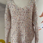 Main Strip  oversize sweater.  Off the shoulder.  Size Small. Twist back. Photo 0