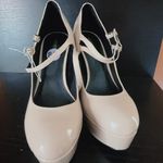 Guess Women's Callyna Platform Round Toe Mary Janes Pump Nude Beige Size 8.5 NEW New with tag Same day shipping Smoke and pets free Slay your elegant look wearing the Callyna platform pump making accent to any ensemble. Patent synthetic upper Adjustable double buckle straps closure Round toe Synthetic lining 4” heels, 1.5" platform, 5.5" covered block heel Synthetic sole Elevate your shoe game with these Women's Callyna Platform Round Toe Mary Janes Pumps in Nude Beige. These patent leather pumps boast an ultra-high block heel and a platform sole, providing both style and comfort. The round toe and adjustable buckle strap make for a perfect fit, while the ivory color and solid pattern make them versatile for any occasion. These women's size 8.5 heels feature the iconic character Marie and are a new addition to your wardrobe, ready to take on the town. Photo 7