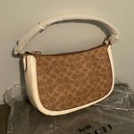 Coach Signature logo designer purse Photo 0