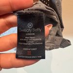 Sweaty Betty  gray racerback tank with laser cut on sides size medium Photo 4