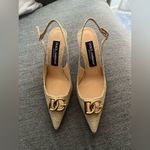 Dolce & Gabbana
Logo-embellished raffia slingback pumps Photo 10