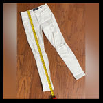 Hollister White high-rise Super Skinny Rugged ripped Jeans - size 5 reg. Junior. Gently warn and excellent rugged condition. Measurements approximately 14” waste x 38 1/2” long x 10” rise. Non smoking home. priced to sell at as is condition. Don’t like my price, make reasonable offer! And thank you for checking my closet. Photo 9