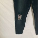 Tractr: Stretchy Skinny Jeans with red flannel covered holes Photo 5