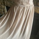 Christina Wu NWT--TWO PIECE TAUPE FORMAL SET-SIZE 10 Stunning lace sleeveless top, fully lined, buttons down the back, long flowy skirt, fully lined, back zip, a beautiful two piece set, perfect for wedding, prom, any formal occasion, brand new with tags. Measurements: Top: Bust: armpit to armpit 20 inches  Length: shoulder seam to bottom 17 inches  Skirt: Waist: side to side 15 inches  Length: waistband to bottom 45 inches Photo 4