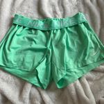 Nike green running shorts Photo 0