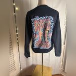 Pink and Black Crew Neck Sweater with Bold Design 1975 Tour Unisex Small Photo 1