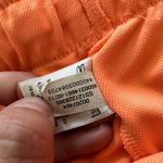 Under Armour women’s loose fit orange & pink athletic shorts large Photo 3