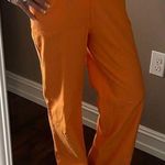 SheIn orange pants with hip cut out Photo 10