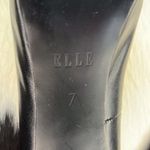 Elle bow on back of the black faux leather platform heels Size 7 M stilettos. Photo 5