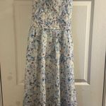 American Eagle WOMEN BLUE FLORAL FLUTTER SLEEVE SMOCKED MIDI DRESS Photo 1