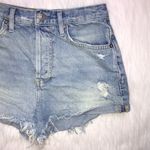 We The Free  Women’s Distressed Raw Hem Light Wash Button-Up Denim Shorts Photo 2